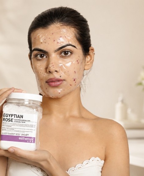 Model wearing an Esthemax Egyptian Rose HydroJelly mask and holding the jar